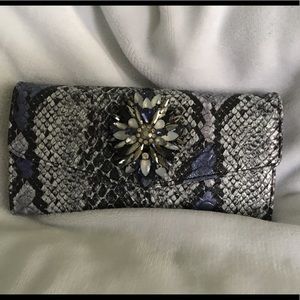 NWOT snake print clutch made by Klutch